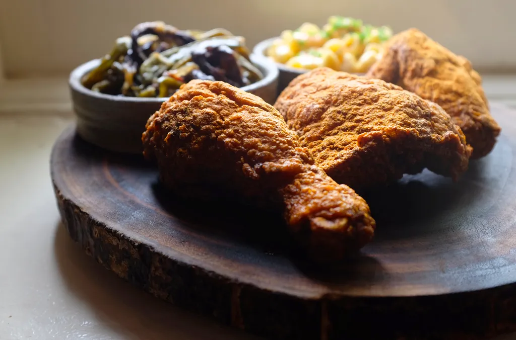 Husk signature dishes Shrimp and Grits, Pimento Cheese, Fried Chicken, seasonal vegetable plates